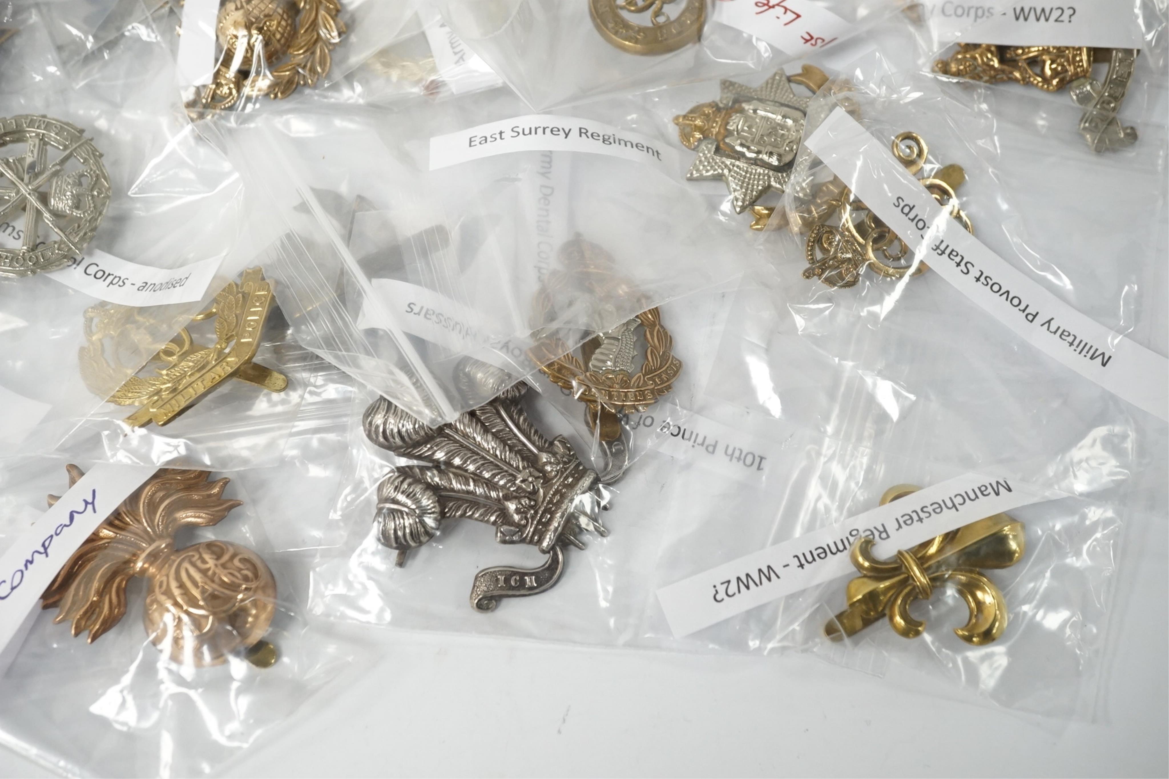 Fifty military cap badges, including; the Duke of Lancaster’s Own regiment, the Blues and Royals, Glider Pilot regiment, Sherwood Foresters regiment, Leicestershire regiment, Royal West Kent regiment, Inns of Court regim
